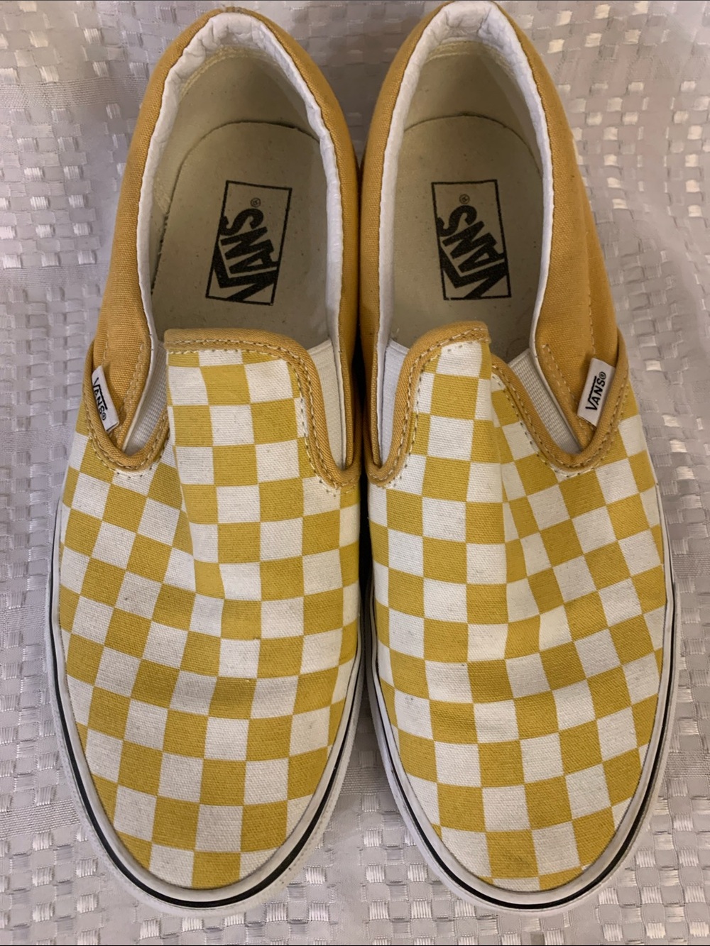 Vans yellow and white slip- on sneakers, men’s size 8.5 or women’s size 10.